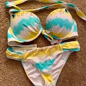 Bikini top and bottom. Missing 1 stone on the top.